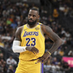 Oct 15, 2024; Las Vegas, Nevada, USA; Los Angeles Lakers forward LeBron James (23) looks on against the Golden State Warriors in the first quarter during a NBA preseason game at T-Mobile Arena.