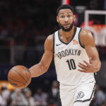 Oct 23, 2024; Atlanta, Georgia, USA; Brooklyn Nets guard Ben Simmons (10) directs teammates while controlling the ball during the first half at State Farm Arena.