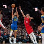 Oct 23, 2024; Portland, Oregon, USA; Golden State Warriors point guard Stephen Curry (30) shoots the ball against Portland Trailblazers forward Toumani Camara (33) during the second half at Moda Center. Mandatory Credit: Stephen Brashear-Imagn Images