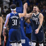 Oct 24, 2024; Dallas, Texas, USA; Dallas Mavericks guard Klay Thompson (31) and guard Luka Doncic (77) celebrate during the second half against the San Antonio Spurs at the American Airlines Center.