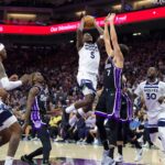 Oct 24, 2024; Sacramento, California, USA; Minnesota Timberwolves guard Anthony Edwards (5) drives to the basket against Sacramento Kings forward Doug McDermott (7) during the fourth quarter at Golden 1 Center. Mandatory Credit: Sergio Estrada-Imagn Images