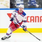 Oct 19, 2024; Toronto, Ontario, CAN; New York Rangers left wing Alexis Lafreniere (13) skates during the warmup before a game against the Toronto Maple Leafs at Scotiabank Arena. Mandatory Credit: Nick Turchiaro-Imagn Images