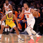 Oct 25, 2024; New York, New York, USA; New York Knicks guard Jalen Brunson (11) controls the ball against Indiana Pacers guard Andrew Nembhard (2) during the first quarter at Madison Square Garden.