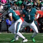 Philadelphia Eagles quarterback Jalen Hurts (1) hands off to running back Saquon Barkley (26) in the second quarter of the NFL Week 8 game between the Cincinnati Bengals and the Philadelphia Eagles at Paycor Stadium in downtown Cincinnati on Sunday, Oct. 27, 2024.