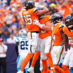 NFL: Carolina Panthers at Denver Broncos. Oct 27, 2024; Denver, Colorado, USA; Denver Broncos tight end Nate Adkins (45) celebrates his touchdown with tight end Lucas Krull (85) in the first half against the Carolina Panthers at Empower Field at Mile High. Mandatory Credit: Ron Chenoy-Imagn Images