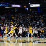 Oct 27, 2024; Indianapolis, Indiana, USA; Indiana Pacers guard Tyrese Haliburton (0) shoots a long three point shot to tie the game with seconds left against the Philadelphia 76ers at Gainbridge Fieldhouse. Mandatory Credit: Marc Lebryk-Imagn Images