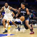 Oct 28, 2024; Orlando, Florida, USA; Orlando Magic forward Paolo Banchero (5) drives to the hoop past Indiana Pacers forward Obi Toppin (1) in the first quarter at Kia Center. Mandatory Credit: Nathan Ray Seebeck-Imagn Images