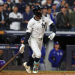 Oct 29, 2024; Bronx, New York, USA; New York Yankees third baseman Jazz Chisholm Jr. (13) hits a single against the Los Angeles Dodgers in the third inning during game four of the 2024 MLB World Series at Yankee Stadium. Mandatory Credit: Vincent Carchietta-Imagn Images