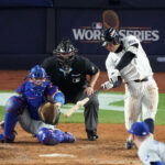 Oct 29, 2024; Bronx, New York, USA; New York Yankees shortstop Anthony Volpe (11) hits a grand slam against the Los Angeles Dodgers in the third inning during game four of the 2024 MLB World Series at Yankee Stadium. Mandatory Credit: Robert Deutsch-Imagn Images