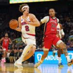 Oct 29, 2024; San Francisco, California, USA; Golden State Warriors guard Brandin Podziemski (2) drives past New Orleans Pelicans guard Jordan Hawkins (24) in the second quarter at the Chase Center. Mandatory Credit: Cary Edmondson-Imagn Images