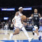 Oct 30, 2024; Oklahoma City, Oklahoma, USA; Oklahoma City Thunder guard Shai Gilgeous-Alexander (2) drives to the basket beside San Antonio Spurs forward Keldon Johnson (0) during the second half at Paycom Center. Mandatory Credit: Alonzo Adams-Imagn Images