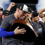 Oct 31, 2024; New York, New York, USA; Los Angeles Dodgers first baseman Freddie Freeman (5) celebrates with the Willie Mays World Series Most Valuable Player Award after being name MVP of the 2024 MLB World Series against the New York Yankees at Yankee Stadium. Mandatory Credit: Brad Penner-Imagn Images