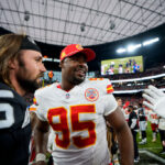 LAS VEGAS, NEVADA - OCTOBER 27: Quarterback Gardner Minshew #15 of the Las Vegas Raiders and defensive tackle Chris Jones #95 of the Kansas City Chiefs interact after an NFL football game, at Allegiant Stadium on October 27, 2024 in Las Vegas, Nevada.
