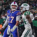 Oct 14, 2024; East Rutherford, New Jersey, USA; Buffalo Bills quarterback Josh Allen (17) yells at New York Jets linebacker Jamien Sherwood (44) after throwing a touchdown pass during the first half at MetLife Stadium.