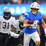 Oct 27, 2024; Inglewood, California, USA; Los Angeles Chargers wide receiver Ladd McConkey (15) runs the ball for a touchdown against the New Orleans Saints during the second half at SoFi Stadium.