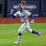 Oct 30, 2024; New York, New York, USA; Los Angeles Dodgers shortstop Mookie Betts (50) celebrates after hitting a sacrifice fly during the eighth inning against the New York Yankees in game four of the 2024 MLB World Series at Yankee Stadium.