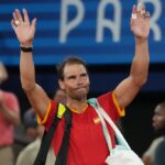 Jul 31, 2024; Paris, France; Rafael Nadal (ESP) waves to the crowd after losing to Austin Krajicek and Rajeev Ram (USA) in a men's doubles quarterfinal tennis match during the Paris 2024 Olympic Summer Games at Stade Roland Garros.