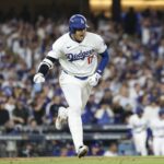 Oct 5, 2024; Los Angeles, California, USA; Los Angeles Dodgers designated hitter Shohei Ohtani (17) reacts after getting a base hit in the fourth inning against the San Diego Padres during game one of the NLDS for the 2024 MLB Playoffs at Dodger Stadium.