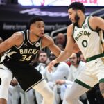 Jan 11, 2024; Milwaukee, Wisconsin, USA; Boston Celtics forward Jayson Tatum (0) drives for the basket against Milwaukee Bucks forward Giannis Antetokounmpo (34) in the second quarter at Fiserv Forum.