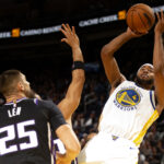 Oct 11, 2024; San Francisco, California, USA; Golden State Warriors guard Moses Moody (4) shoots over Sacramento Kings center Alex Len (25) during the third quarter at Chase Center. Mandatory Credit: D. Ross Cameron-Imagn Images