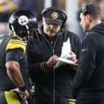 Pittsburgh Steelers quarterback Russell Wilson (3) talks with offensive coordinator Arthur Smith (middle) and quarterbacks coach Tom Arth (right) against the New York Giants during the fourth quarter at Acrisure Stadium.
