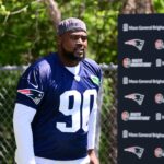New England Patriots defensive tackle Christian Barmore (90) walks to the practice fields for minicamp at Gillette Stadium.