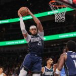 Dallas Mavericks center Daniel Gafford (21) grabs a rebound against the Atlanta Hawks in the third quarter at State Farm Arena.