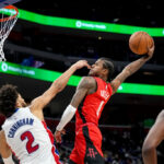 DETROIT, MICHIGAN - NOVEMBER 10: Jalen Green #4 of the Houston Rockets dunks the ball against Cade Cunningham #2 of the Detroit Pistons during the fourth quarter at Little Caesars Arena on November 10, 2024 in Detroit, Michigan. NOTE TO USER: User expressly acknowledges and agrees that, by downloading and or using this photograph, User is consenting to the terms and conditions of the Getty Images License Agreement. (Photo by Nic Antaya/Getty Images)