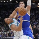Charlotte Hornets forward Grant Williams (2) reacts after running into Milwaukee Bucks center Brook Lopez (11) in the second half at Fiserv Forum.