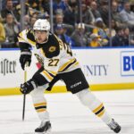 Boston Bruins defenseman Hampus Lindholm (27) controls the puck against the St. Louis Blues during the first period at Enterprise Center. Mandatory