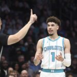 Charlotte Hornets guard LaMelo Ball (1) reacts to a foul call by crew chief Kevin Scott (24) during the first half against the Orlando Magic at the Spectrum Center.