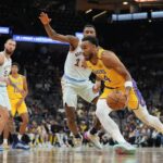 Los Angeles Lakers forward Armel Traore (94) dribbles against San Antonio Spurs guard Blake Wesley (14) in the second half at Frost Bank Center.