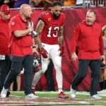 Tampa Bay Buccaneers wide receiver Mike Evans (13) leaves the game after an apparent injury against the Baltimore Ravens during the first half at Raymond James Stadium.