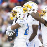 Nov 3, 2024; Cleveland, Ohio, USA; Los Angeles Chargers cornerback Tarheeb Still (29) celebrates his interception with safety Derwin James Jr. (3) and cornerback Eli Apple (41) during the fourth quarter against the Cleveland Browns at Huntington Bank Field.