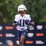 New England Patriots wide receiver Tyquan Thornton (11) runs after making a catch during training camp at Gillette Stadium.