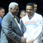 Apr 12, 2017; Oklahoma City, OK, USA; NBA great Oscar Robertson (left) congratulates Oklahoma City Thunder guard Russell Westbrook (0) during a presentation honoring him for breaking Robertson's single season triple double record prior to game against the Denver Nuggets at Chesapeake Energy Arena.