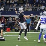 Nov 25, 2021; Arlington, Texas, USA; Las Vegas Raiders kicker Daniel Carlson (2) kicks the game winning field goal in overtime against the Dallas Cowboys at AT&T Stadium. Mandatory Credit: Tim Heitman-USA TODAY Sports