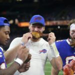 Thanksgiving NFL. Buffalo Bills wide receiver Stefon Diggs (14) and quarterback Josh Allen (17) and tight end Dawson Knox (88) enjoy a turkey leg at the end of their game against the New Orleans Saints at the Caesars Superdome.