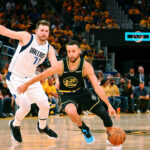 May 26, 2022; San Francisco, California, USA; NBA; Golden State Warriors guard Stephen Curry (30) dribbles the ball against Dallas Mavericks guard Luka Doncic (77) during the second half of game five of the 2022 western conference finals at Chase Center.