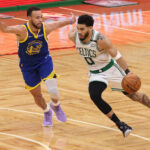 Jun 16, 2022; Boston, Massachusetts, USA; NBA; Boston Celtics forward Jayson Tatum (0) dribbles the ball against Golden State Warriors guard Stephen Curry (30) during the second quarter of game six in the 2022 NBA Finals at the TD Garden.