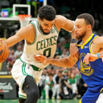 Jun 16, 2022; Boston, Massachusetts, USA; Boston Celtics forward Jayson Tatum (0) handles the ball against Golden State Warriors guard Stephen Curry (30) during the fourth quarter in game six of the 2022 NBA Finals at TD Garden.