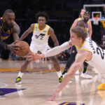 Nov 4, 2022; Los Angeles, California, USA; Los Angeles Lakers forward LeBron James (6) and Utah Jazz forward Lauri Markkanen (23) battle for the ball in the second half at Crypto.com Arena.