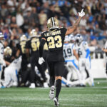 Sep 18, 2023; Charlotte, North Carolina, USA; New Orleans Saints cornerback Marshon Lattimore (23) signals a turnover by Carolina Panthers in the second quarter at Bank of America Stadium. Mandatory Credit: Bob Donnan-USA TODAY Sports
