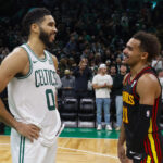 Nov 26, 2023; Boston, Massachusetts, USA; Boston Celtics forward Jayson Tatum (0) shares a laugh with Atlanta Hawks guard Trae Young (11) after their game at TD Garden.