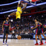 Nov 29, 2023; Detroit, Michigan, USA; Los Angeles Lakers forward LeBron James (23) dunks on Detroit Pistons forward Marvin Bagley III (35) in the first half at Little Caesars Arena.