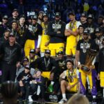 Dec 9, 2023; Las Vegas, Nevada, USA; The Los Angeles Lakers pose on the podium after defeating the Indiana Pacers in the in season tournament championship final at T-Mobile Arena. Mandatory Credit: Kyle Terada-USA TODAY Sports