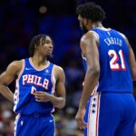 Jan 15, 2024; Philadelphia, Pennsylvania, USA; Philadelphia 76ers center Joel Embiid (21) and guard Tyrese Maxey (0) talk during a break in action in the first quarter against the Houston Rockets at Wells Fargo Center.
