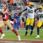 San Francisco 49ers running back Christian McCaffrey (23) crosses the goal line for the decisive touchdown late in the fourth quarter against the Green Bay Packers during their NFC divisional playoff football game Saturday, January 20, 2024, at Levi's Stadium in Santa Clara, California.