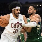 Jan 24, 2024; Milwaukee, Wisconsin, USA; Cleveland Cavaliers center Jarrett Allen (31) drives for the basket against Milwaukee Bucks forward Giannis Antetokounmpo (34) in the third quarter at Fiserv Forum.