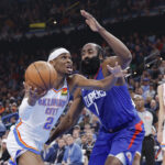 Feb 22, 2024; Oklahoma City, Oklahoma, USA; NBA; Oklahoma City Thunder guard Shai Gilgeous-Alexander (2) moves to the basket beside LA Clippers guard James Harden (1) during the second quarter at Paycom Center.